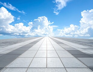 A flat tiled surface extends toward the horizon under a vast, bright blue sky filled with fluffy white cumulus clouds