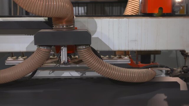 Advanced Suction Hoses Effectively Eliminate Wood Dust From Panel Surfaces During Manufacturing Process . Media