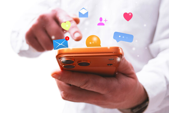 Person using smartphone with floating social media and notification icons such as messages, likes and chat bubbles. Concept of mobile communication, social networks, online and digital engagement. - Powered by Adobe