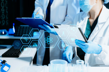 Medical scientists using digital technology and AI tools for laboratory research and diagnostics. Healthcare innovation, biotechnology, data-driven medicine