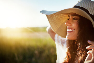 Smile, woman and thinking with hat in nature for fresh air, happy memory and summer holiday. Space, female person and meadow for vision, calm morning and vacation trip of stress relief in countryside