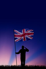 National flag of United Kingdom flutters in military man hands