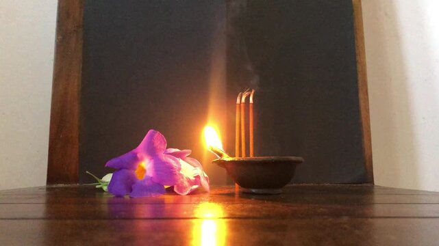 oil lamps lit for the gods in an Asian Buddhist temple. Lord Buddha, spiritual, meditative, Diwali festive