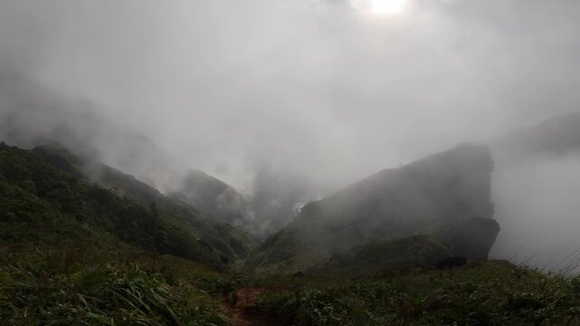 Foggy mountain valley below Mt Guiting Guiting with dense clouds and lush terrain, G2 Sibuyan Philippines
