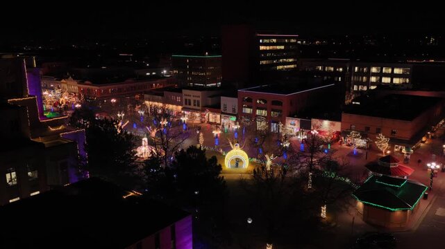 Pearl Street Mall December Winter downtown Boulder Colorado aerial drone Boulder County Court house night time evening Holiday Christmas lights outdoor outside pedestrian shopping mall forward pan up