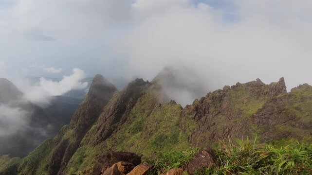 Wind swept peak of Mt Guiting Guiting with low clouds and dramatic mountain terrain, G2 Sibuyan Philippines