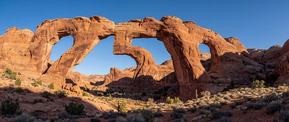 Majestic natural sandstone rock arch formation shaped as the number 250 in a desert landscape, celebrating the American anniversary.