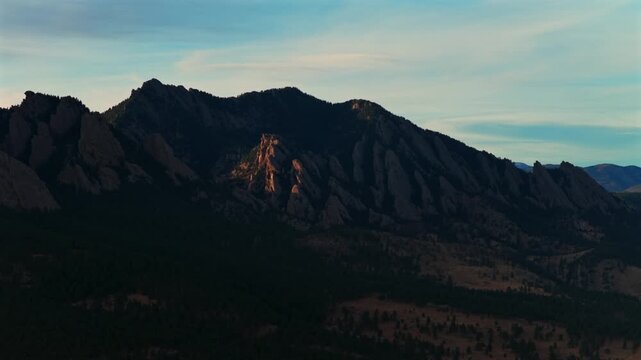 Boulder Flat Irons Mountains vista Chautauqua Park Longs Peak aerial drone Colorado Eldorado Canyon Front Range Rocky Mountains landscape view winter sunset sunny blue sky clouds circle left upwards