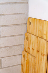 Bamboo cutting boards organized in a kitchen setting, showcasing sustainable and minimalist kitchenware