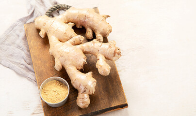 Fresh ginger with sliced and green leaves.