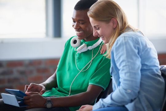 Friends, tablet and students in college for learning, assignment research and thesis review. Technology, happy people and collaboration in university class for education, course or knowledge online - Powered by Adobe