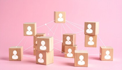Wooden blocks with person icons connected by white lines on pink background symbolizing social and organizational networks