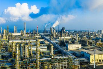Aerial view of an oil refinery and chemical plant with smoking chimneys in industrial area