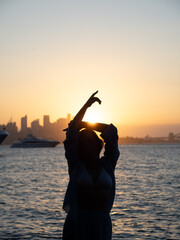 Fototapeta premium silhouette of a woman in the sunset