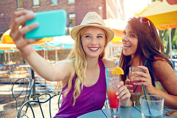 Selfie, outdoor and girl friends at cafe for bonding, memory or social media post on vacation. Happy, cocktails and women with photography picture at restaurant for alcoholic drinks on holiday.
