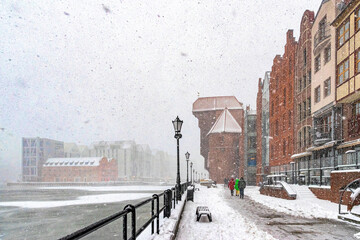 Beautiful ancient houses on the Motlawa river embankment in Gdansk at winter 	