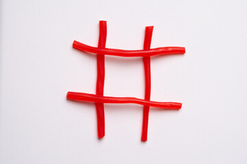 Red Candy Hashtag Symbol on White Background