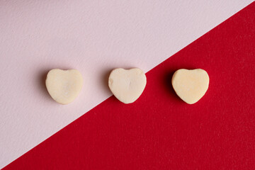 Yellow Candy Hearts on Red and Pink Background