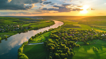 Aerial view of beautiful landscape with river and village at sunset.