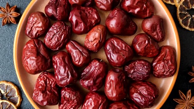 Red dried dates, the Chinese sweet fruit jujube, as a healthy food. Red dates, jujube as a food background for your design