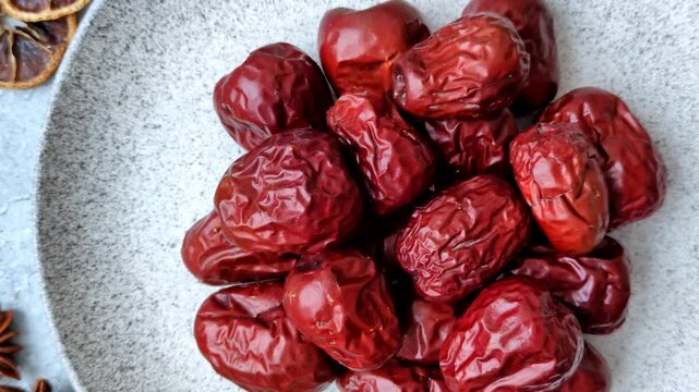 Red dried dates, the Chinese sweet fruit jujube, as a healthy food. Red dates, jujube as a food background for your design