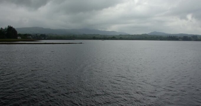 wide panning shot looking north from Bonawe Pier of loch Etive on a stormy rainy day.