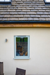 White window blind with some decoration inside on a top flat building