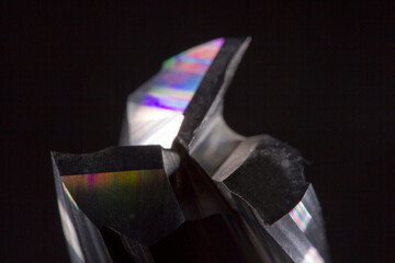 cutting edge of a spiral wood milling cutter in close-up on a black background. spiral carbide milling cutter. cnc tool.