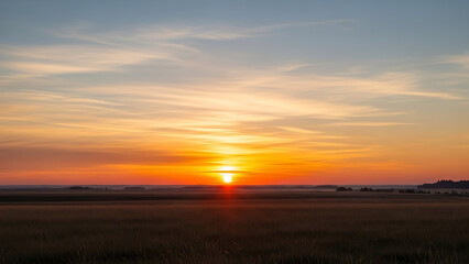 Obraz premium Breathtaking wide shot dramatic golden sunrise or sunset over vast agricultural field landscape nature scenery