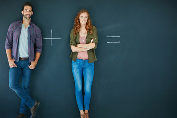 Happy couple, blackboard and relationship with equation for match on a dark background. Portrait, man and woman with smile, addition or problem solving for future goal or commitment on mockup space
