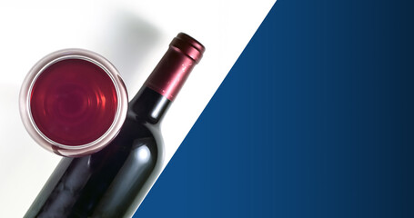 A glass and a bottle of red wine on a white background. Blue background for text.