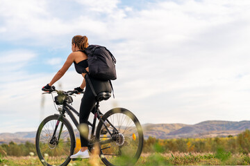 Active lifestyle female cyclist in nature