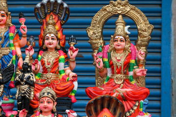 Fototapeta premium Karumari Amman and Kamatchi Amman idols are displayed for sale in a shop for the Golu festival