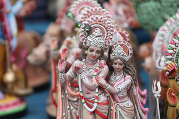 Colorful Krishna and Radha dolls for Sale at a Market