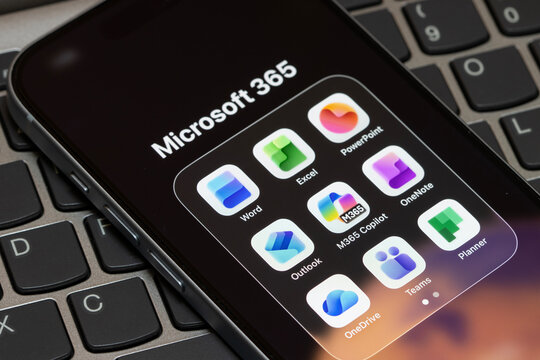 Portland, OR, USA - Jan 14, 2026: Microsoft 365 apps, including Word, Excel, PowerPoint, Outlook, M365 Copilot, OneNote, OneDrive, Teams, and Planner, are seen on the screen of an iPhone.