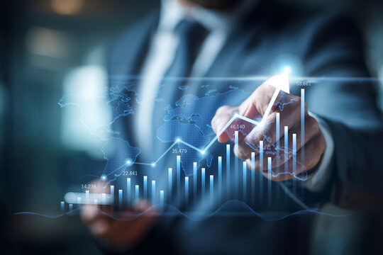 Businessman hand pointing at a futuristic digital interface with a bar chart showing financial growth, stock market success, and business progress. - Powered by Adobe