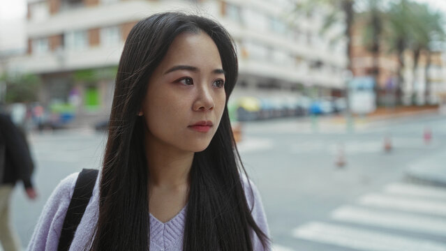 Woman outdoors surprised street urban city expression emotion sweater asian pedestrian shock