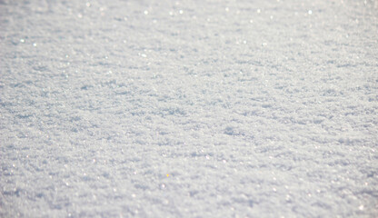 Fresh clean snow texture closeup, winter background with ice crystals