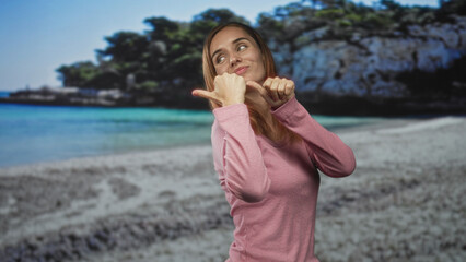 Fototapeta premium Woman showing hands with thumbs pointing to chest, smiling and posing before a beach backdrop in studio; confidence self expression.