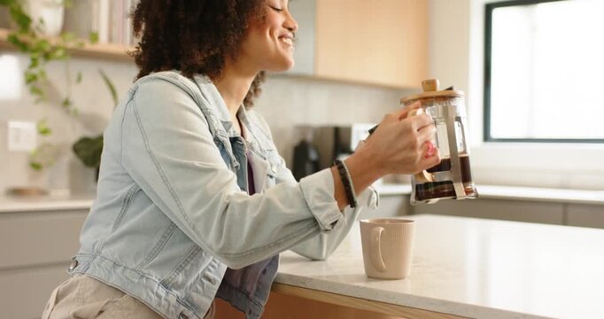 Aligning phone to French press in kitchen African American woman pressing plunger savoring aroma