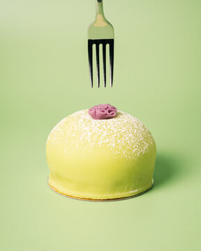 Swedish princess cake with a fork above ready to eat