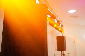 Music Speaker Detail with Colorful Party Lights Inside Club Hall for Celebration and Fun