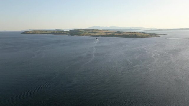 Aerial view of Great Cumbrae Island with Isle of Arran in background