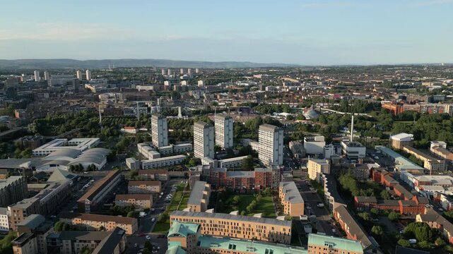 Aerial backtrack of Glasgow Green park and Gorbals district, Scotland