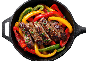Sliced steak fajitas with colorful peppers in a cast iron skillet