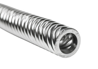 Polished metal tube with spiral grooves, seen head-on against black background