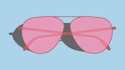 Pink sunglasses isolated on a bright blue background.