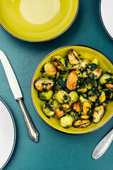 Brussels sprouts with mussels on a plate