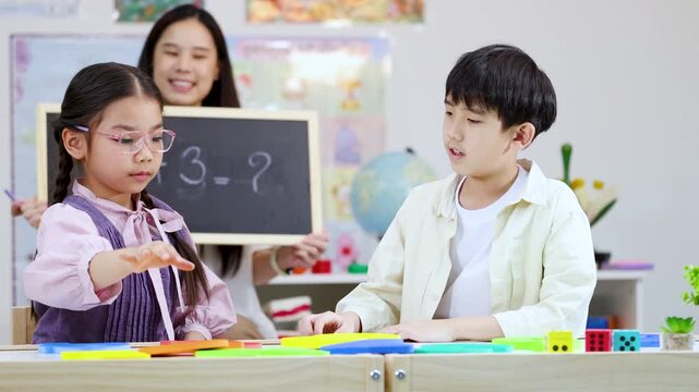 Asian Students and Teacher Learning Math with Letter Blocks in Classroom