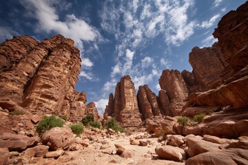 Desert canyon, towering rocks, bright sky